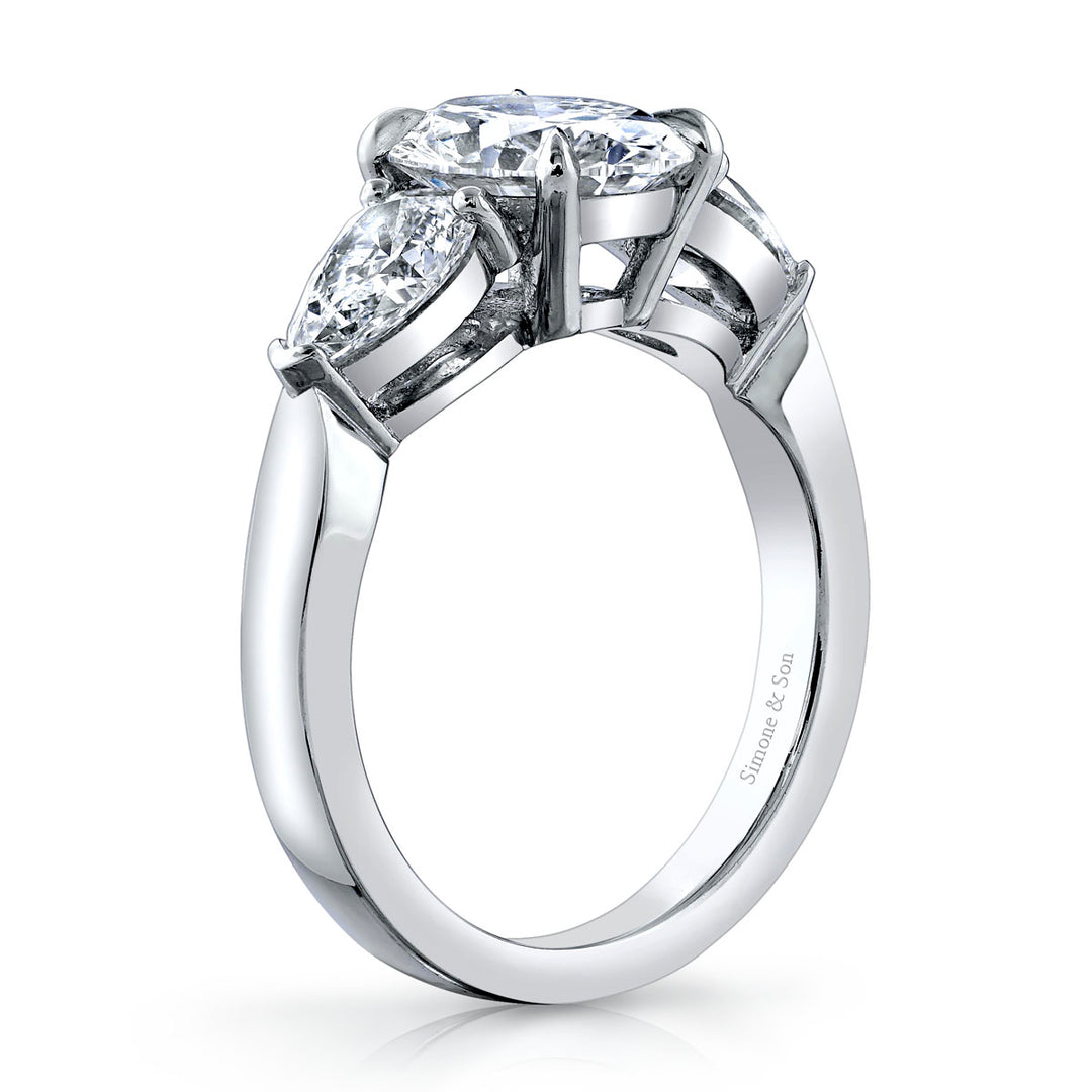 Platinum - 3 Stone Ring featuring 2 pear shape side stones.