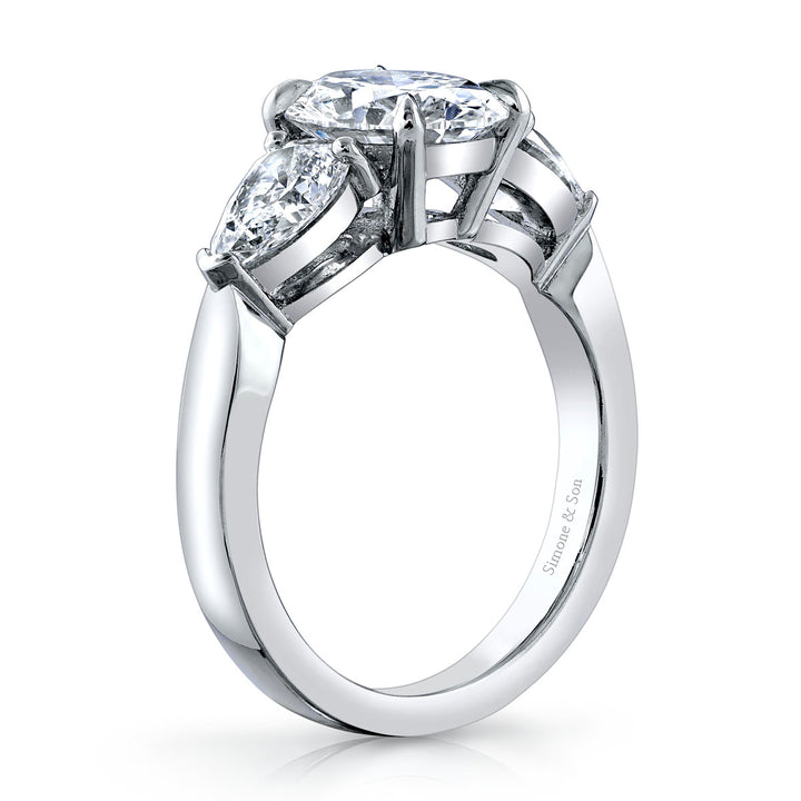 Platinum - 3 Stone Ring featuring 2 pear shape side stones.